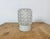 Vintage industrial ceiling or wall light made in former Czechoslivakia during the 1970s. It features a white porcelain...