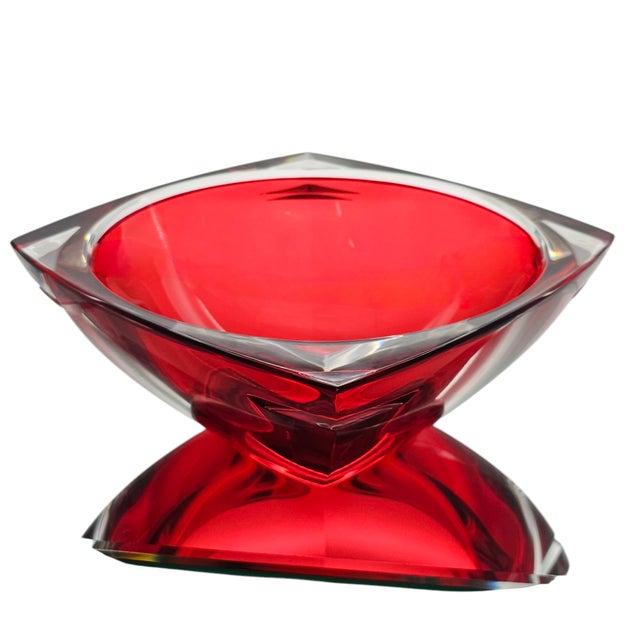 It rests like a secret—ruby red, encased in glass so clear it hums. The Metra bowl by Waterford is a study in modernist...