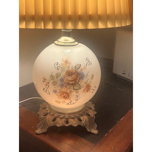 Bring a touch of classic Hollywood Regency charm to your space with this stunning 1978 table lamp manufactured by the...