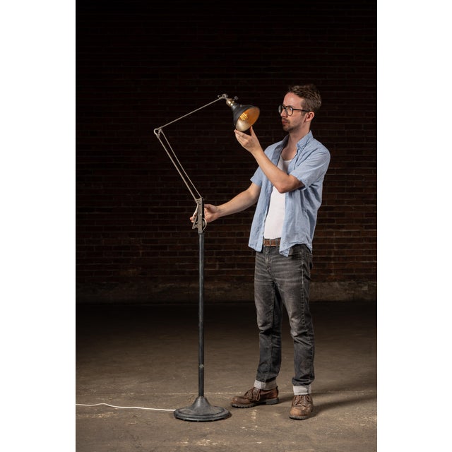 An articulated floor lamp developed by Dazor. The lamp features several working joints allowing for a full range of motion...