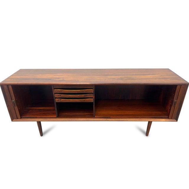 An exceptional example of mid-century Danish design, this sideboard—crafted by Faarup Møbelfabrik in the 1960s—is the work...