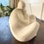 A sculptural vintage stone figure by Marc, Belgium, featuring a softly abstracted seated form with beautifully rounded...