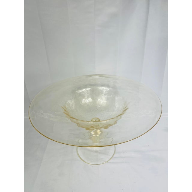 This magnificent Murano glass centerpiece compote is a striking example of Italian glassmaking artistry. Monumental in...