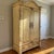 Habersham Plantation armoire with a beautifully distressed cream-yellow painted finish and classic European country...