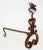 Rare, antique late 19th century folk art wrought iron andirons. Scroll motifs and grotesque head finials.