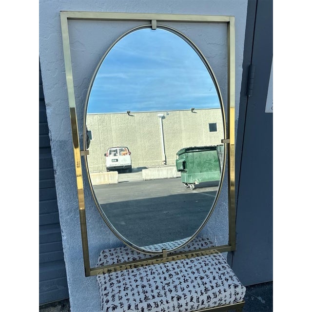 This is a vintage brass Italian mirror. It is excellent condition, no chips in glass. Perfect accent to a mid century home.