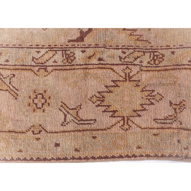 This grand antique Turkish Oushak rug from the early 20th century exemplifies the renowned artistry of Anatolian weaving,...