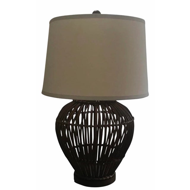 Great looking Rattan lamp made by Ralph Lauren. Great size lamp for a corner table between two sofas or chairs, even...