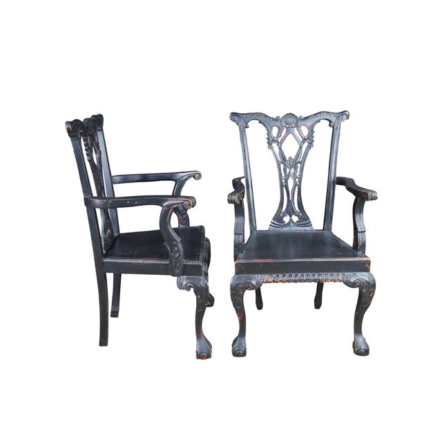 Pair of two vintage English Chippendale / Georgian style dining arm chairs. Made of mahogany featuring a serpentine...