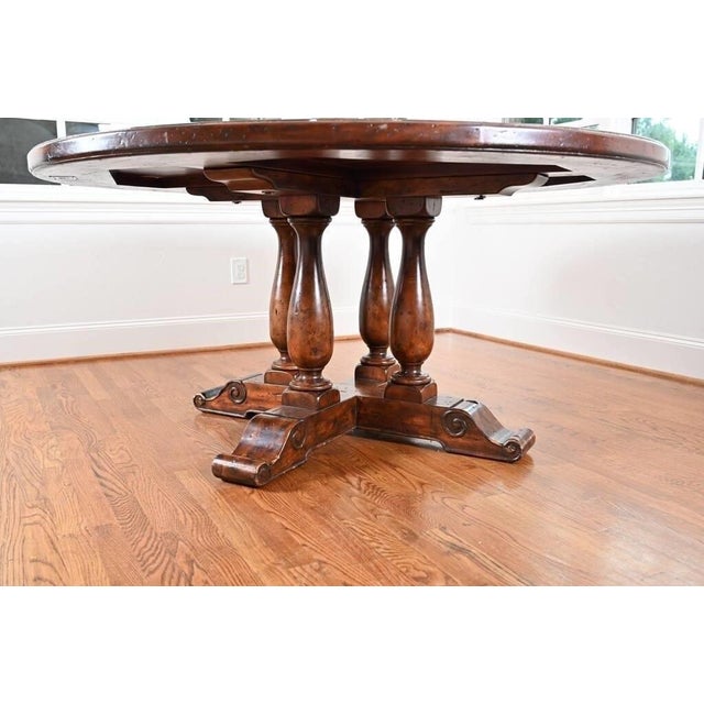 The Theodore Alexander "Castle Bromwich" Round Dining Table is a luxurious addition to any dining room. This elegant piece...