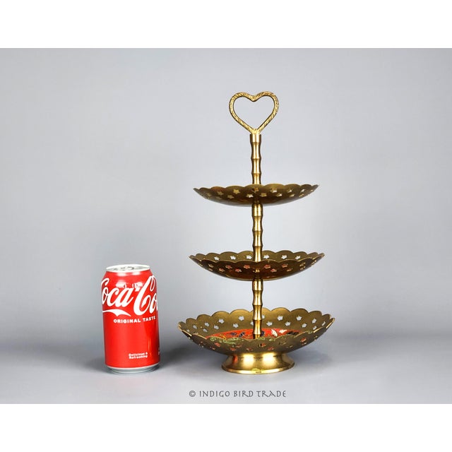 This wonderful 3 tier stand is made from solid brass and decorated with pierced stars, heart handle and enameled patterns...