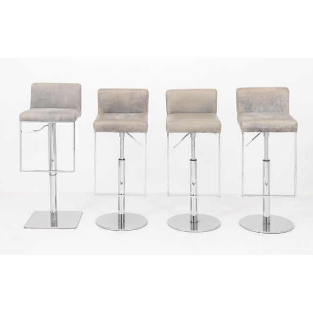 Assembled Set of Four Modern Gray Leather Bar Stools, with adjustable seats on chrome-plated bases. 37.5" H x 14.5" W x...