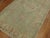 An antique Turkish Oushak small runner from the early 20th century in soft green and pinks 3'4'' x 6'