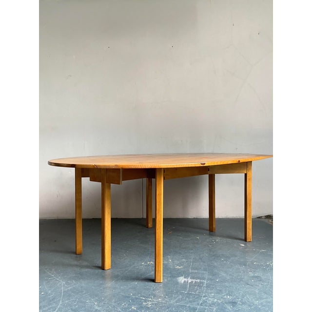 Discover the versatile charm of this vintage Baker Milling Road drop-leaf table, a perfect blend of bohemian spirit and...