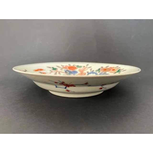 Beautiful porcelain plate with imari decoration from the 19th century. On this plate, the background is white with floral...