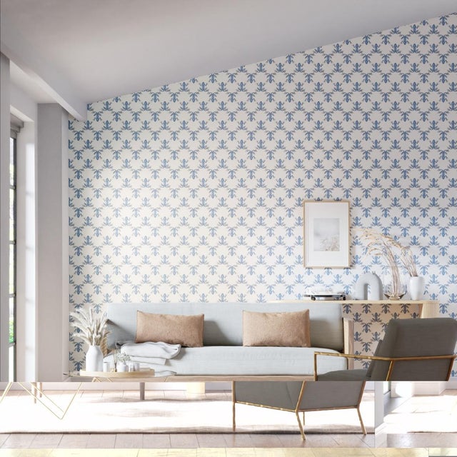 This playful wallpaper features a diamond pattern of whimsical frogs sitting in a trellis formation and pairing perfectly...