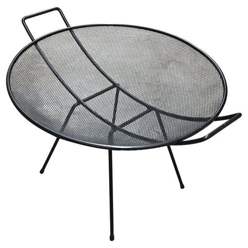 Mid-Century Modern wire magazine table with a convex shape mesh circular body supported by tubular metal legs and arms in...