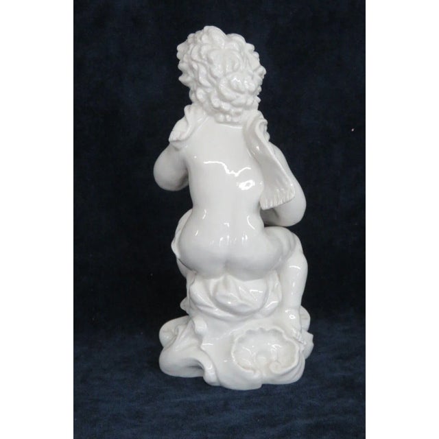 This charming figurine is made of porcelain. This piece is stamped as being made in Italy, see pictures, and we are unsure...