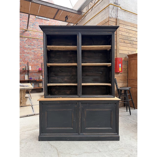 This antique display cabinet with a weathered finish has been fully restored. The upper section consists of 3 shelves made...