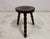 Vintage tripod stool Three turned bobbin-style legs Round wood top featuring a concentric circle (bullseye or target)...