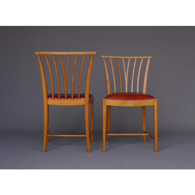 A pair of rare ash wood chairs with leather seats. Designed by in 1947 by Elmar Berkovich for the employees of Bataafsche...