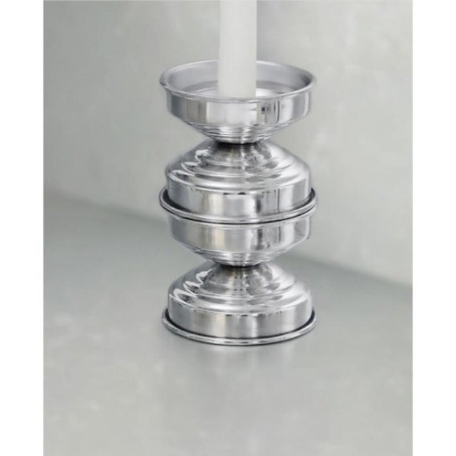 Rl 05 maxi candleholder in polished aluminum by caspal dimensions: ø 9 x h 14 cm. Materials: polished aluminum. Sculptural...