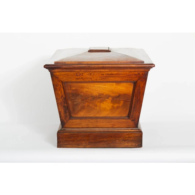 Very fine 19th century English regency style mahogany wine cellarette of sarcophagus form. The cellarette features a...