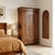 Small Charles X walnut wardrobe. Front with a pair of paneled doors and a drawer in the lower section, plinth feet, oak...
