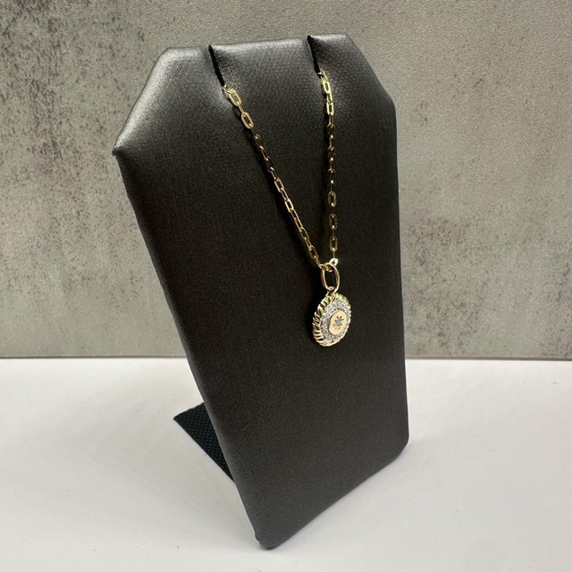 This stylish diamond necklace on a paperclip chain in 10kt yellow gold features 0.08 carats total weight of natural GH SI...