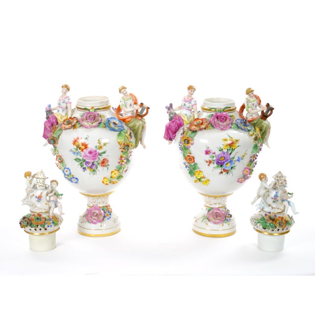 An exceptional pair of 19th century Meissen porcelain covered urns, beautifully crafted in Germany during the mid to late...