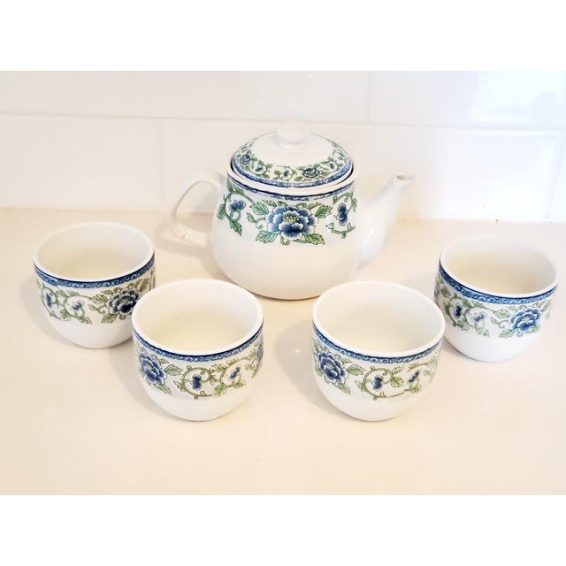 Lovely Porcelain Tea Pot and 4 Cups with a blue and green floral "White Jade" pattern on white background. Tea pot has...