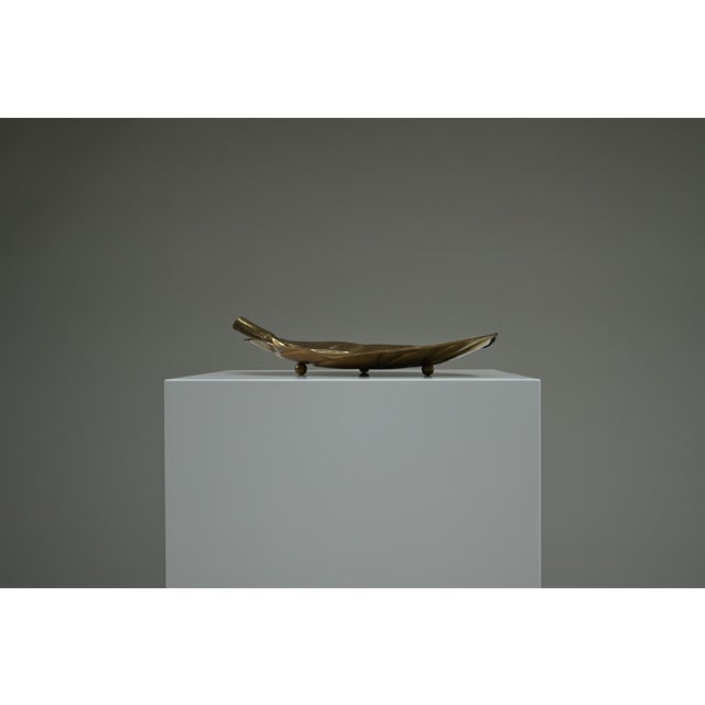 Brass leaf fruit bowl, 1970s Europe. This fruit bowl is designed in the elegant shape of a leaf. The sculptural stem...