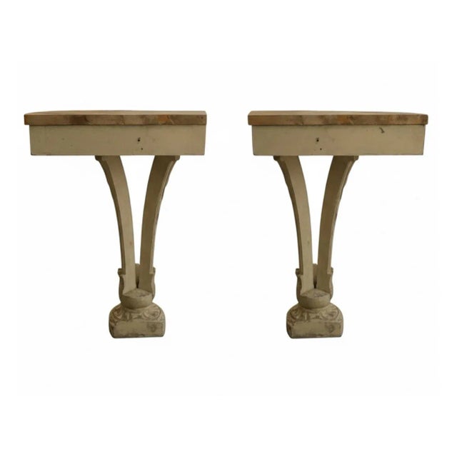 This elegant pair of console tables features a classic Neoclassical-style design, perfect for adding architectural...