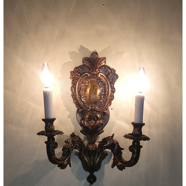 These antique French sconces are made from a cast bronze and are heavy. They're have intriquette details in the arm and...