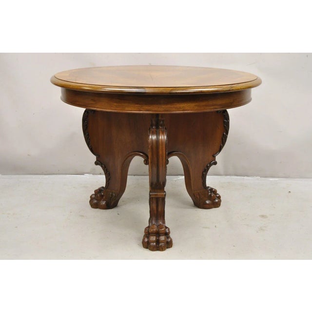 Antique German Renaissance Revival Carved Walnut Paw Feet Round Center Table by Leonardo Tisch. Item features a Tripod...