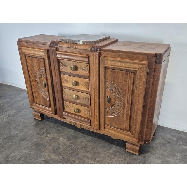 Art Deco Sideboard in Carved Oak with Marble Top, 1930s, in Very Good conditions. Designed 1920 to 1949