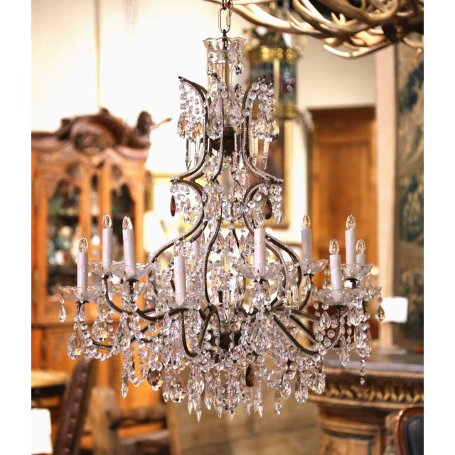 A striking example of late 19th-century Italian craftsmanship, this antique twelve-light chandelier combines an...