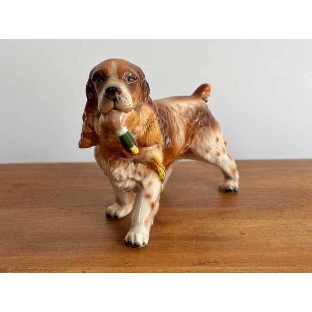 Delightful vintage hunting porcelain dog figurine of a beautiful springer spaniel with pheasant. Most items found at Pub &...
