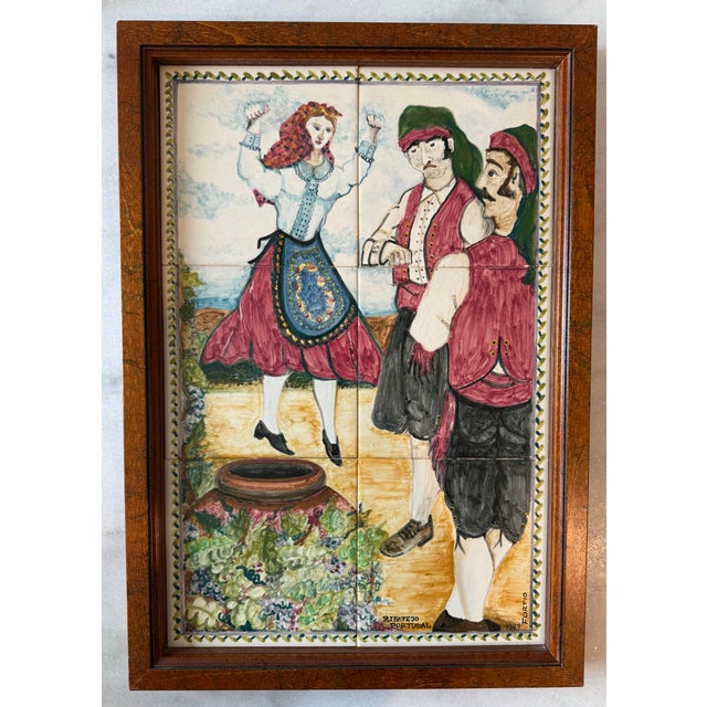Framed vintage Portuguese faience tile art featuring hand painted figures dancing in traditional attire. Signed by the...