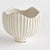 With a ribbed texture and wavy rim, this ceramic pot certainly brings the charm. Finished in a rich, reactive glaze, it...