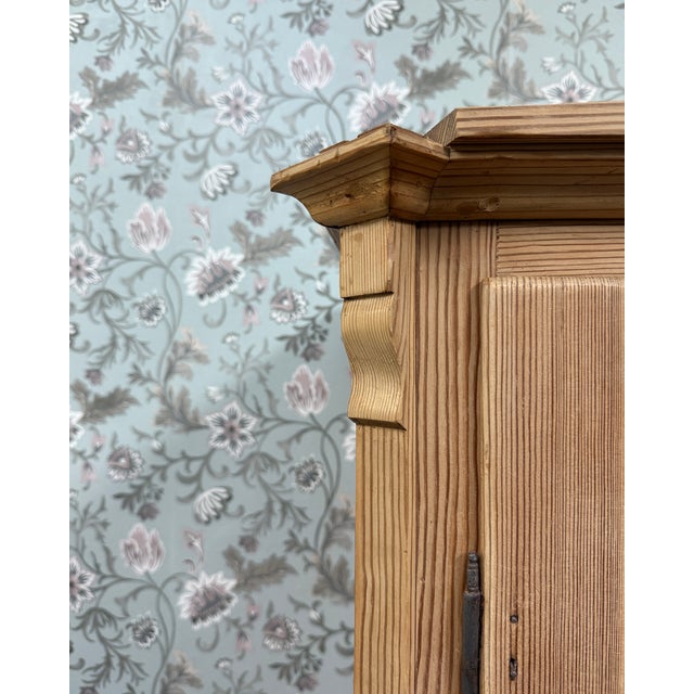Authentic and full of charm, this antique english wardrobe is a rare piece that combines character, history, and...