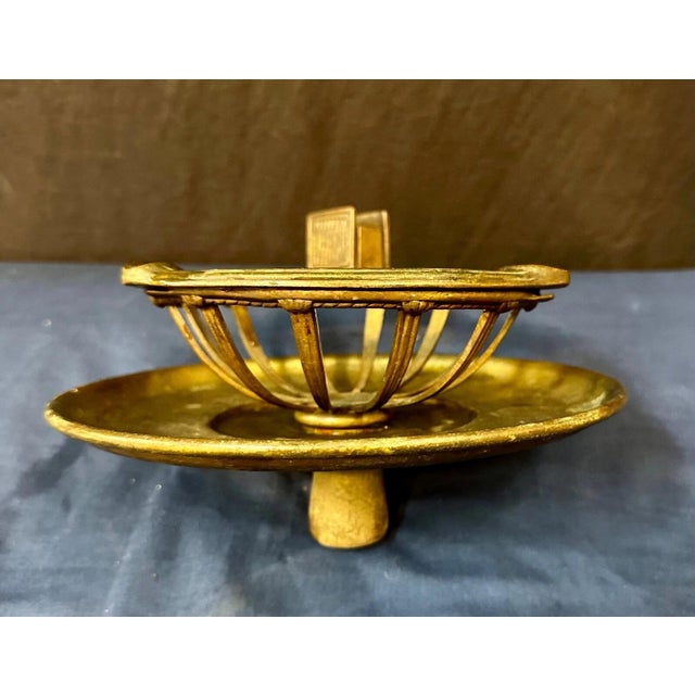 This vintage Tiffany Studios bronze ash tray stand top dates from the early 1900’s. It has a round underplate that...