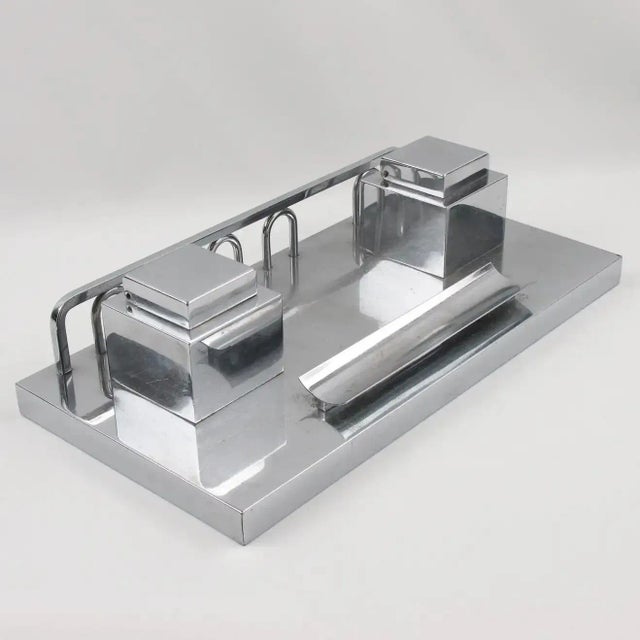 French designer Jacques Adnet (1901 - 1984) designed this elegant Art Deco modernist chromed metal heavy desk accessory....