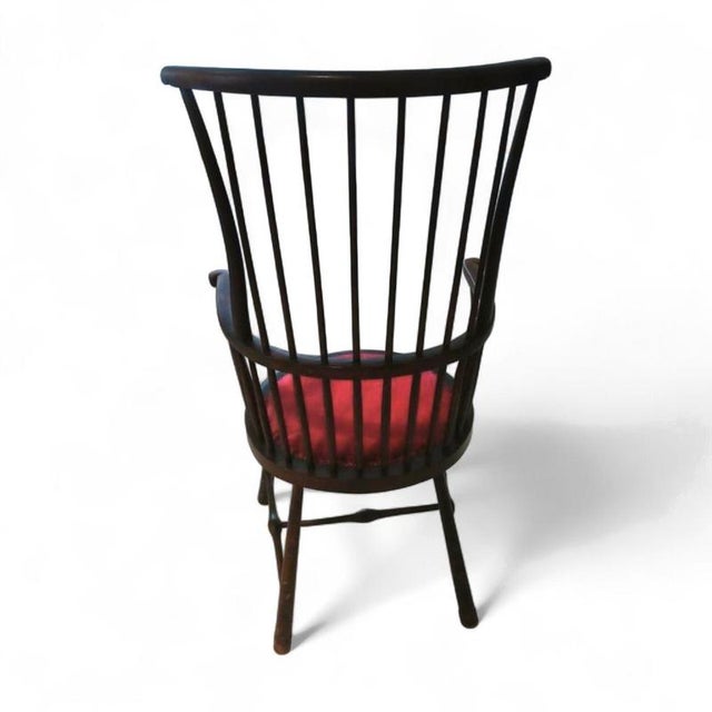A fine spindle back library or windsor chair in the manner of liberty & co, regent st., london from the arts & crafts era,...