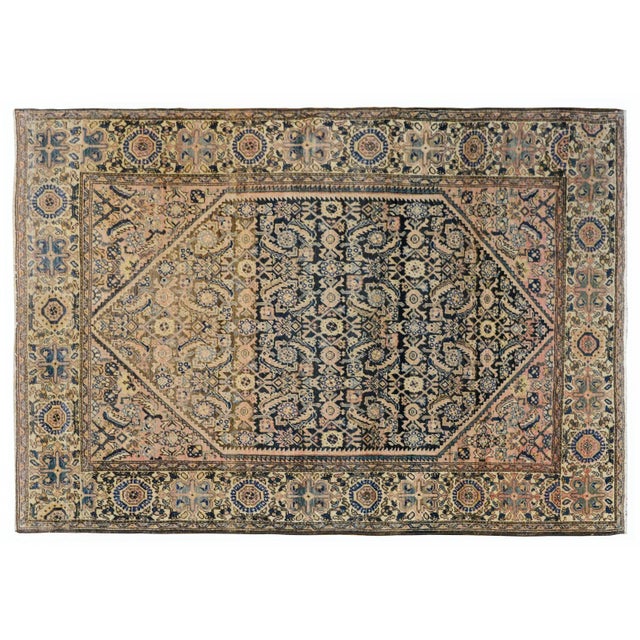 An outstanding early 20th century Persian Sarouk Farahan rug, that has been antique washed, with a large central diamond...