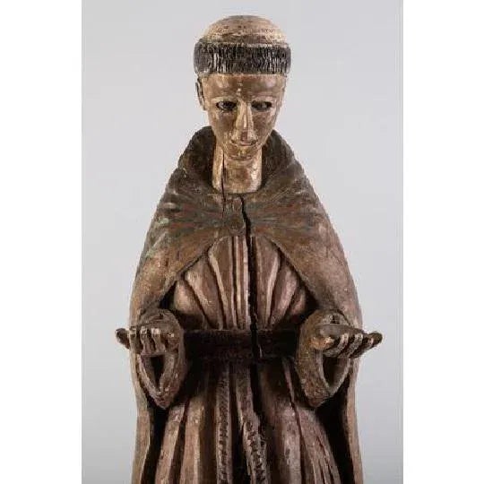 South American Santos Figure, circa 18th Century Wooden sculpture of a monk with glass eyes, most likely Saint Francis,...