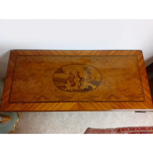 Chest of drawers inlaid with two images of landscape in briar, cherry, olive and ebony wood, the result of high Italian...