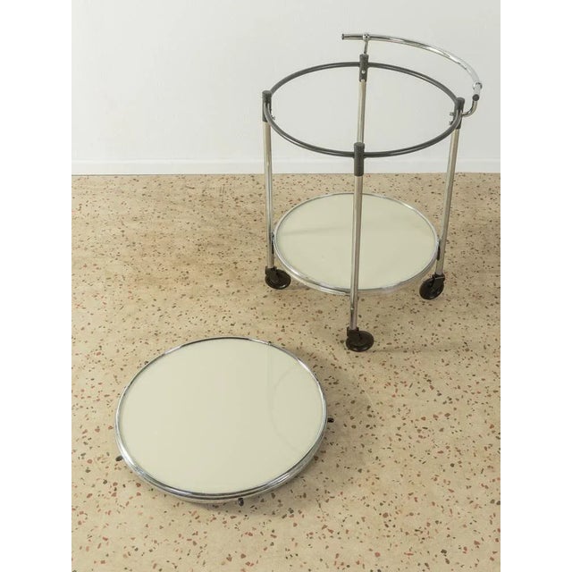 High -quality Art Deco serving car from the 1930s. Frame made of fully chrome -plated steel tube with two shelves made of...