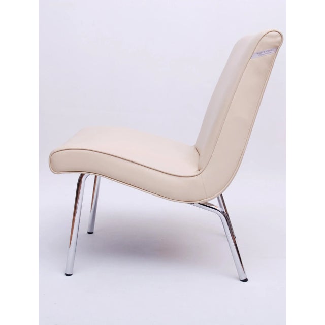 Two (2) Vostra armchairs from the Walter Knoll Classic Edition. Cream white leather with chrome-plated tubular steel legs....