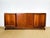 Art deco walnut sideboard dating from the 1930s. comprising four storage doors with shelves. the two outer doors feature a...